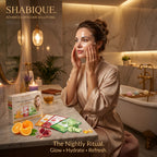 A woman in a robe applying a hydrating vitamin c sheet mask in a luxurious bathroom setting.